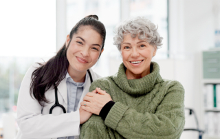 Happy female doctor discusses the benefits of kegel exercises with female patient.